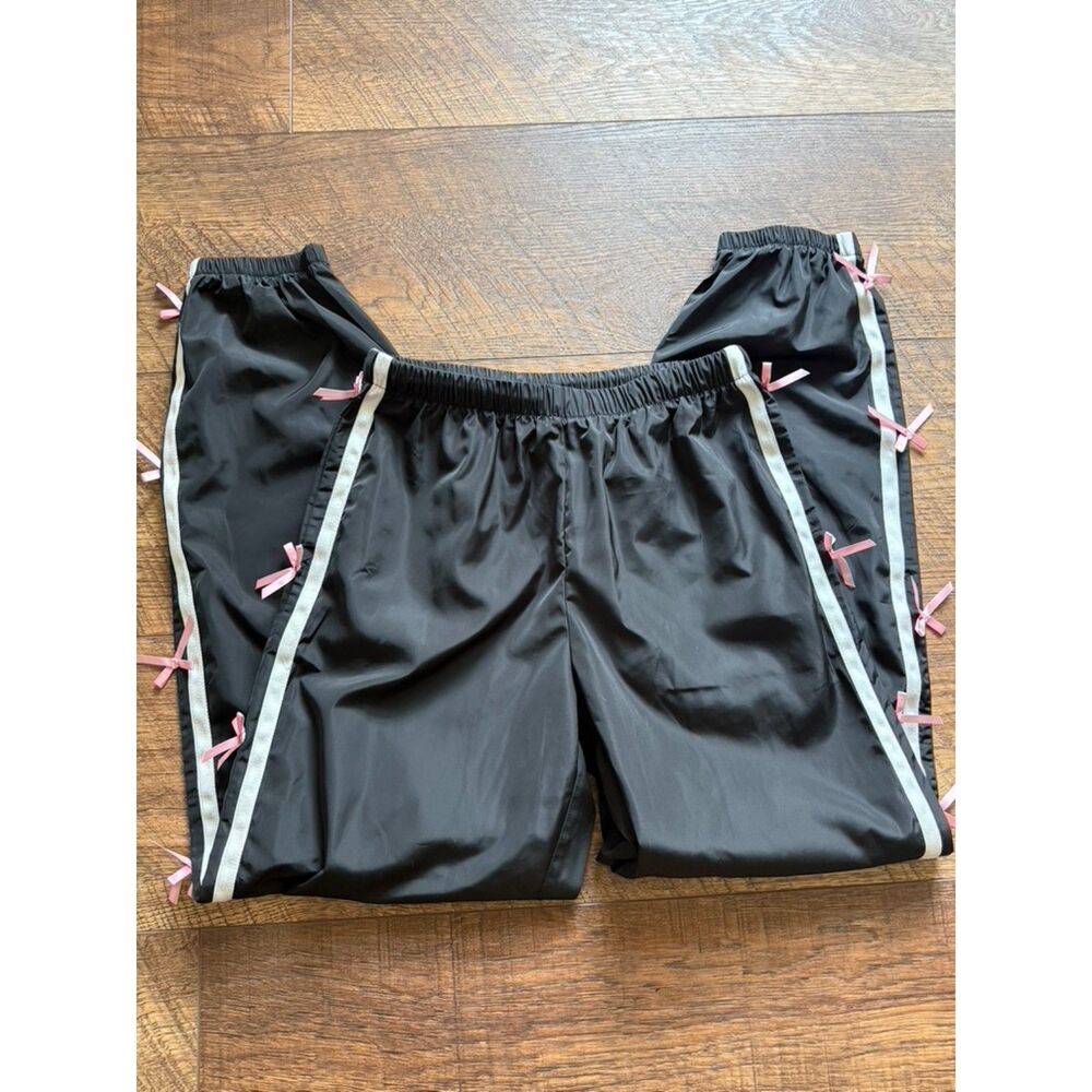Carbon black track pants pink satin ribbon side stripe